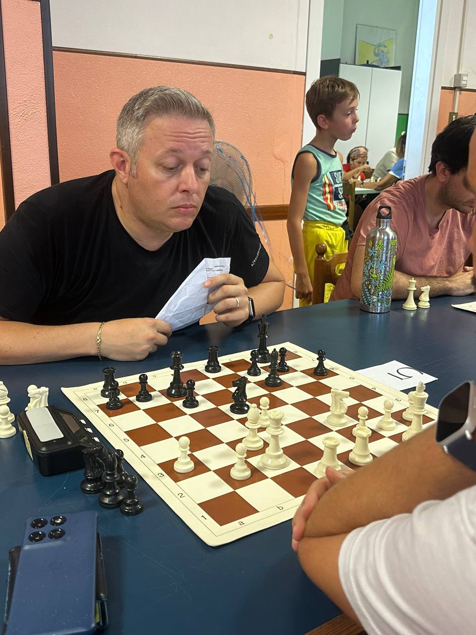 Michele Marchioro seated at a chessboard during a tournament